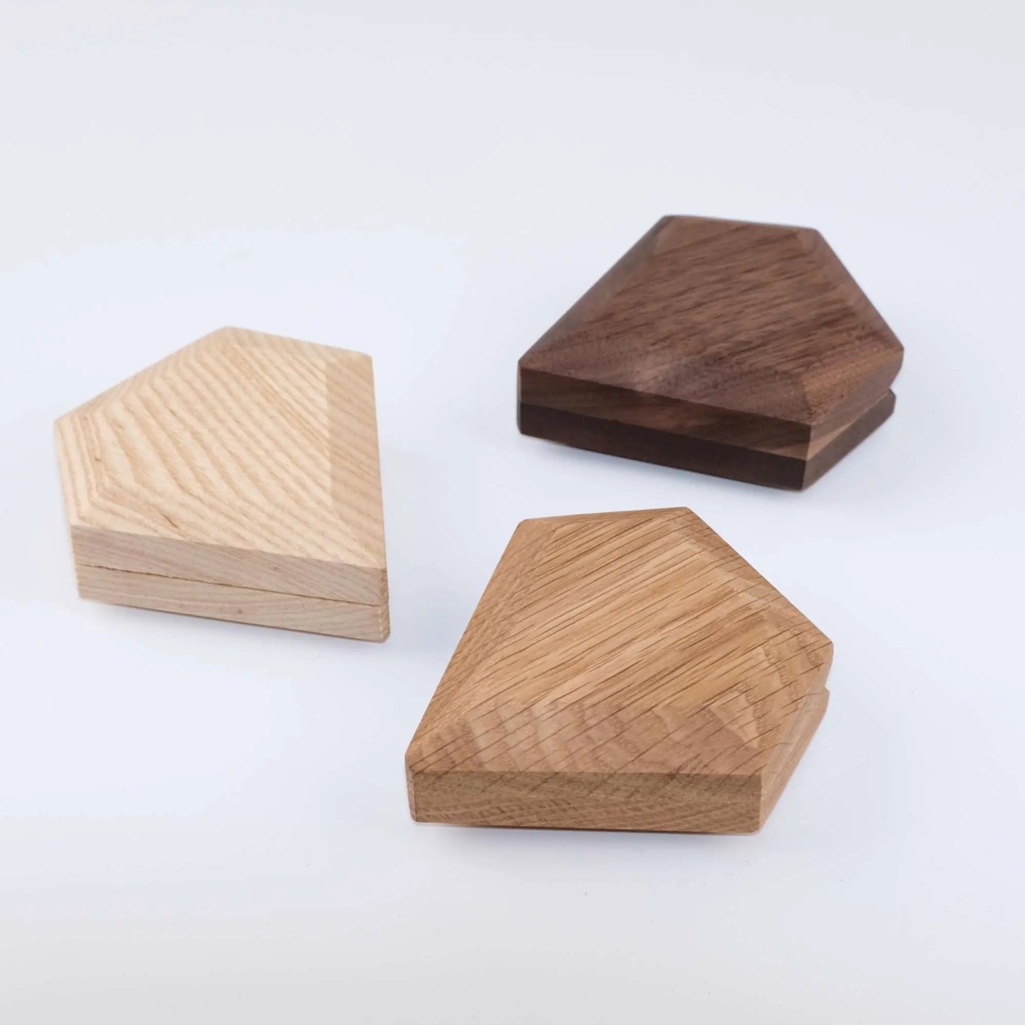 Black walnut, ash wood, and white oak diamond ring boxes closed - three premium wood finish options