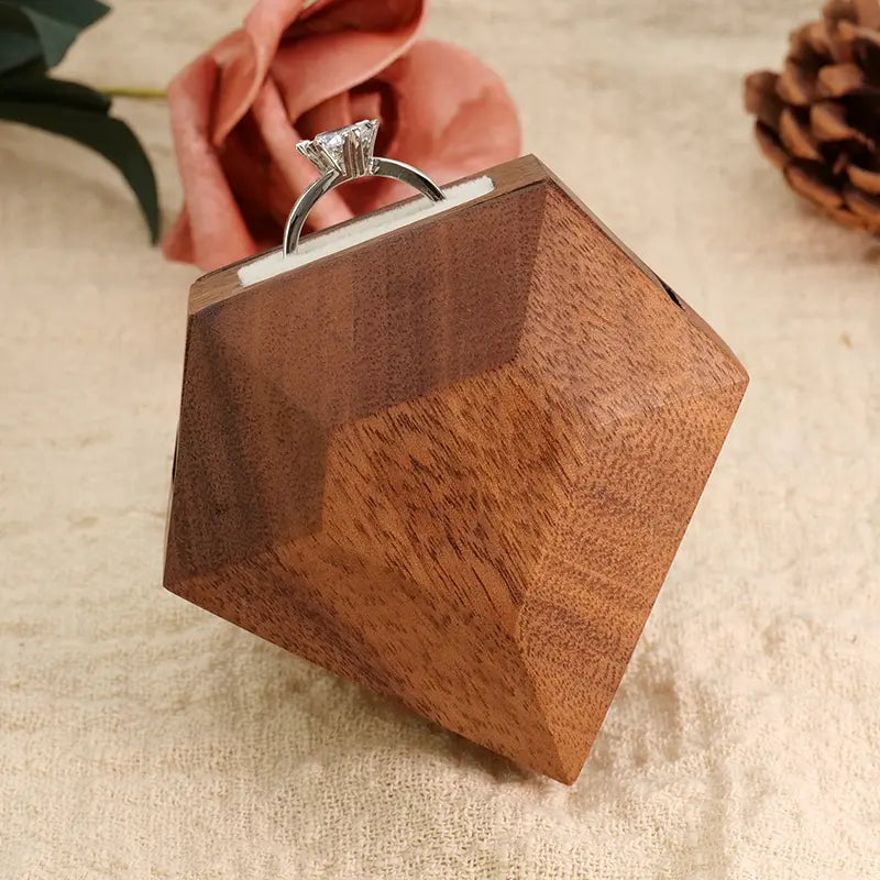 3D diamond-shaped rotating ring box with ring flipped out - front view displaying premium wood craftsmanship and ring presentation