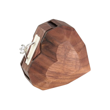  3D heart-shaped rotating ring box with ring flipped out - angled view showing fixed-axis rotation mechanism