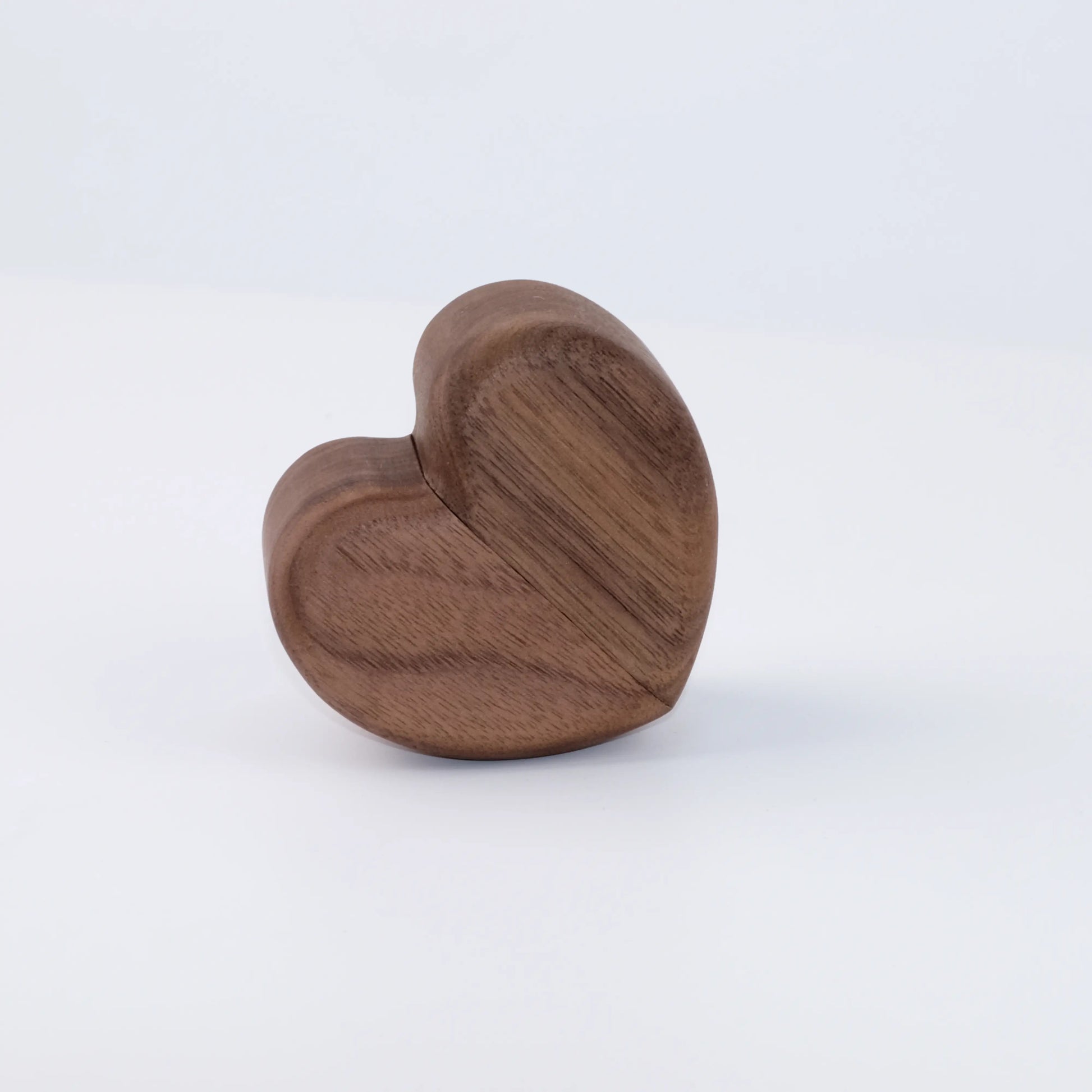 Heart-shaped double ring box angled view without engraving - showcasing seamless closure line with no exposed hinges for unified visual design