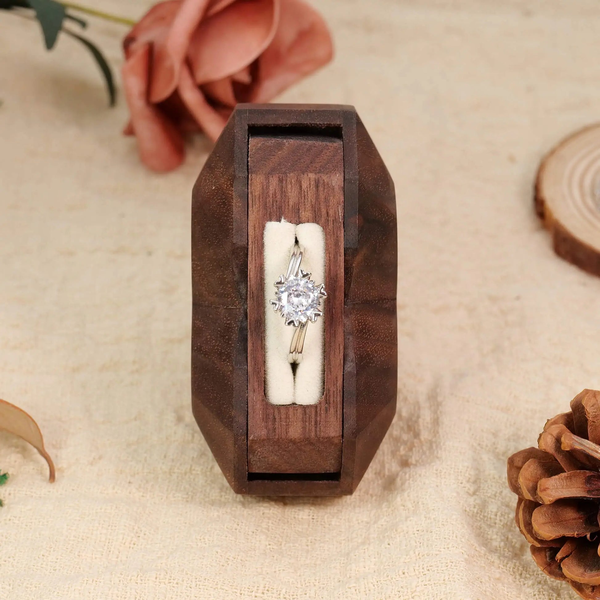 3D heart-shaped rotating ring box with ring flipped out - side view showing rotation axis and mechanism