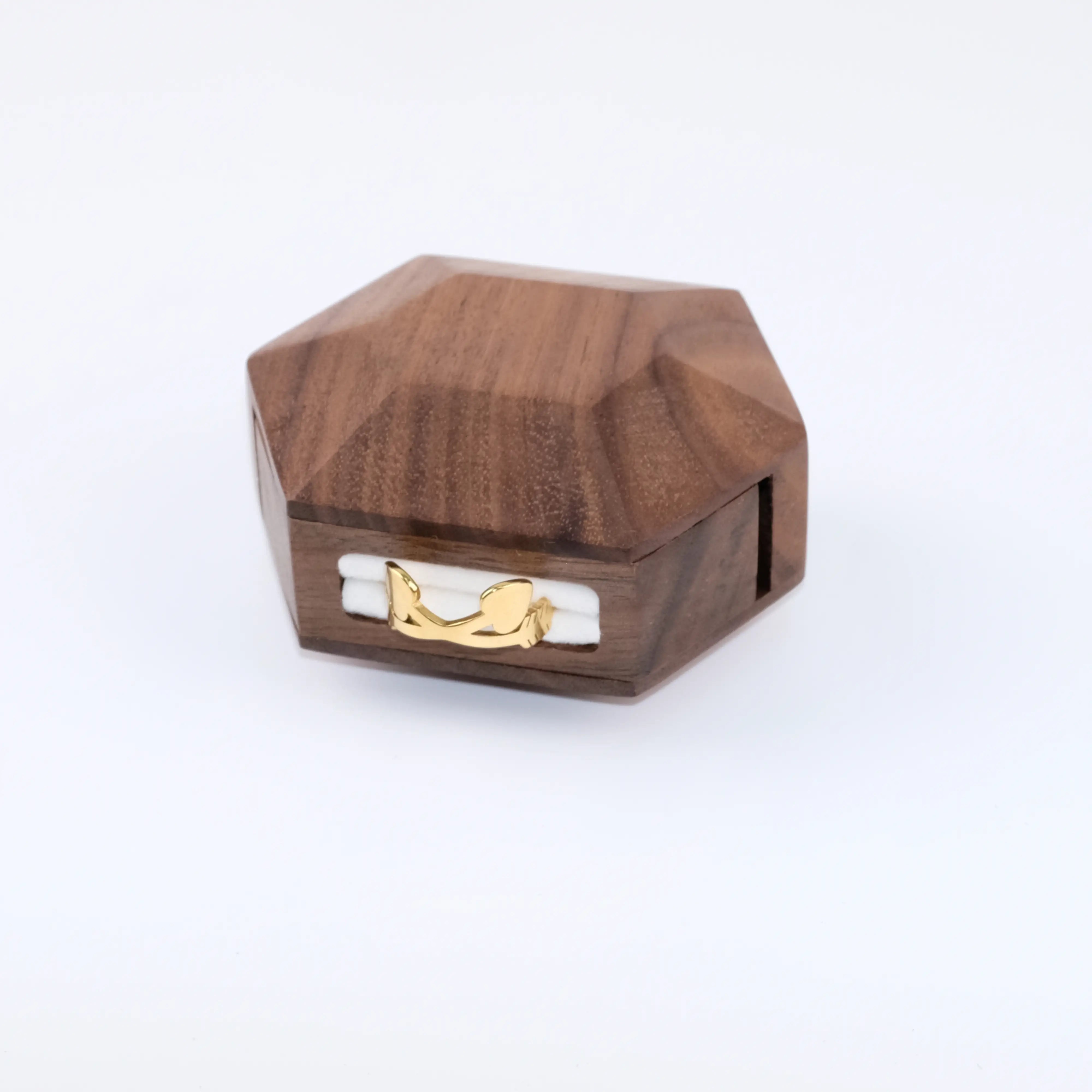  3D hexagonal rotating ring box with ring flipped out - side view showing rotation axis and ring display mechanism