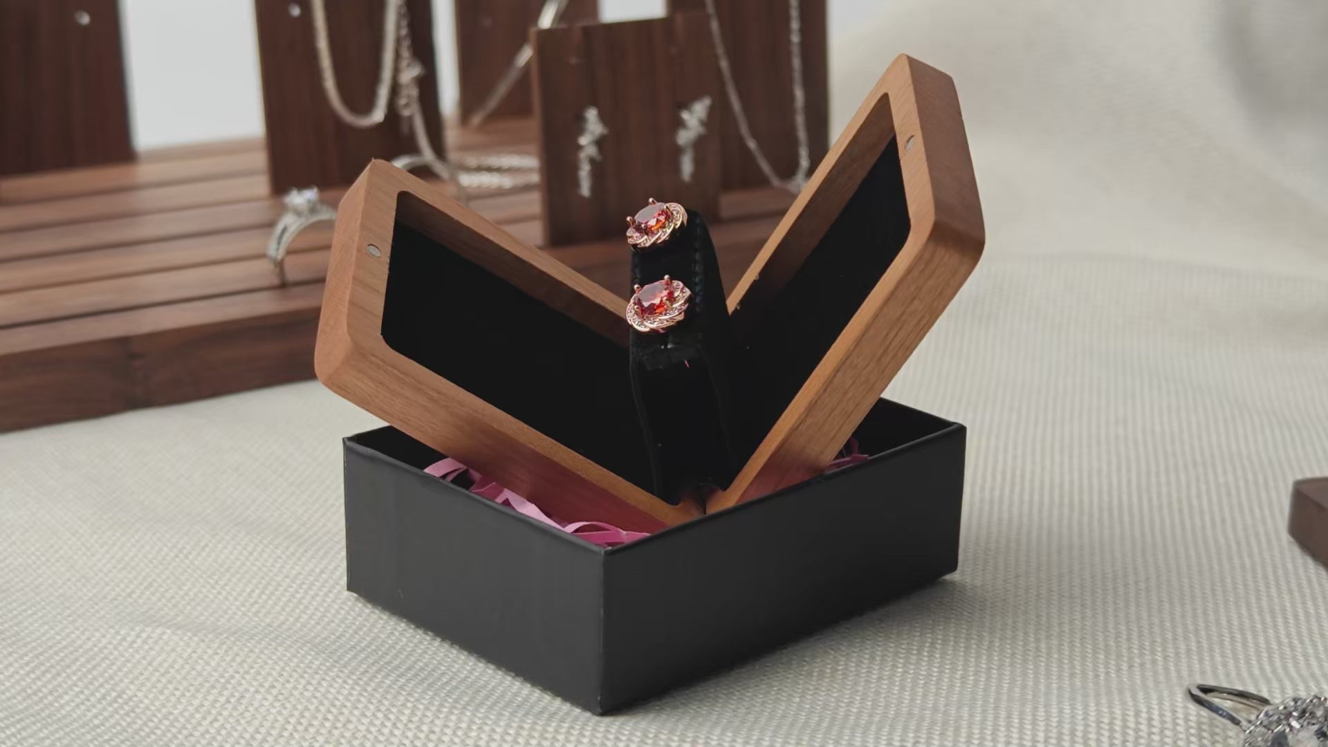 Black walnut and cherry wood earring boxes 360 degree rotation - hand-held open display showcasing both wood finishes